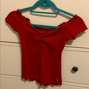 A guess off the shoulders (red) crop top